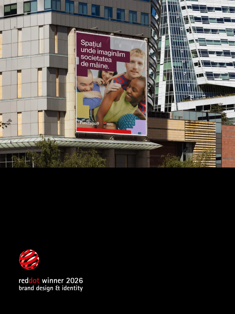 Fundația9 campaign billboard with the Red Dot Award 2026 winner mark